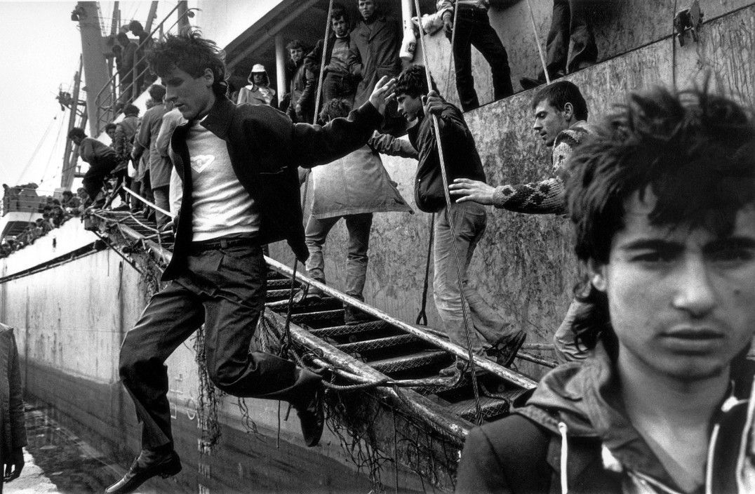ITALY. Apulia. Brindisi. Albanian refugees. 1991. After being refused political asylum by the Italian authorities, the Albanian passengers aboard the boat "Tirana" are sent back to their country.