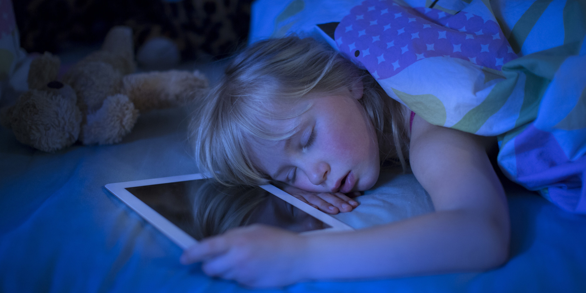 GIRL SLEEPING WITH TABLET COMPUTER